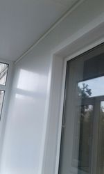 Обшивка балконной стены с откосами балконного блока.